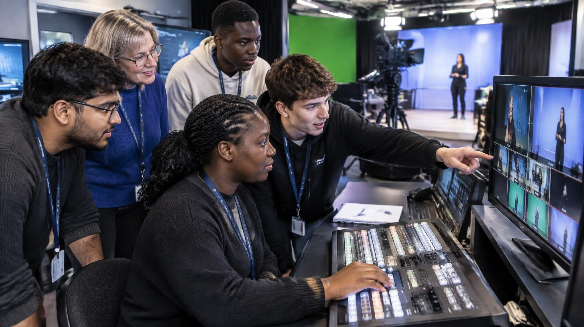 Trainees practising live camera switching in a broadcast training studio