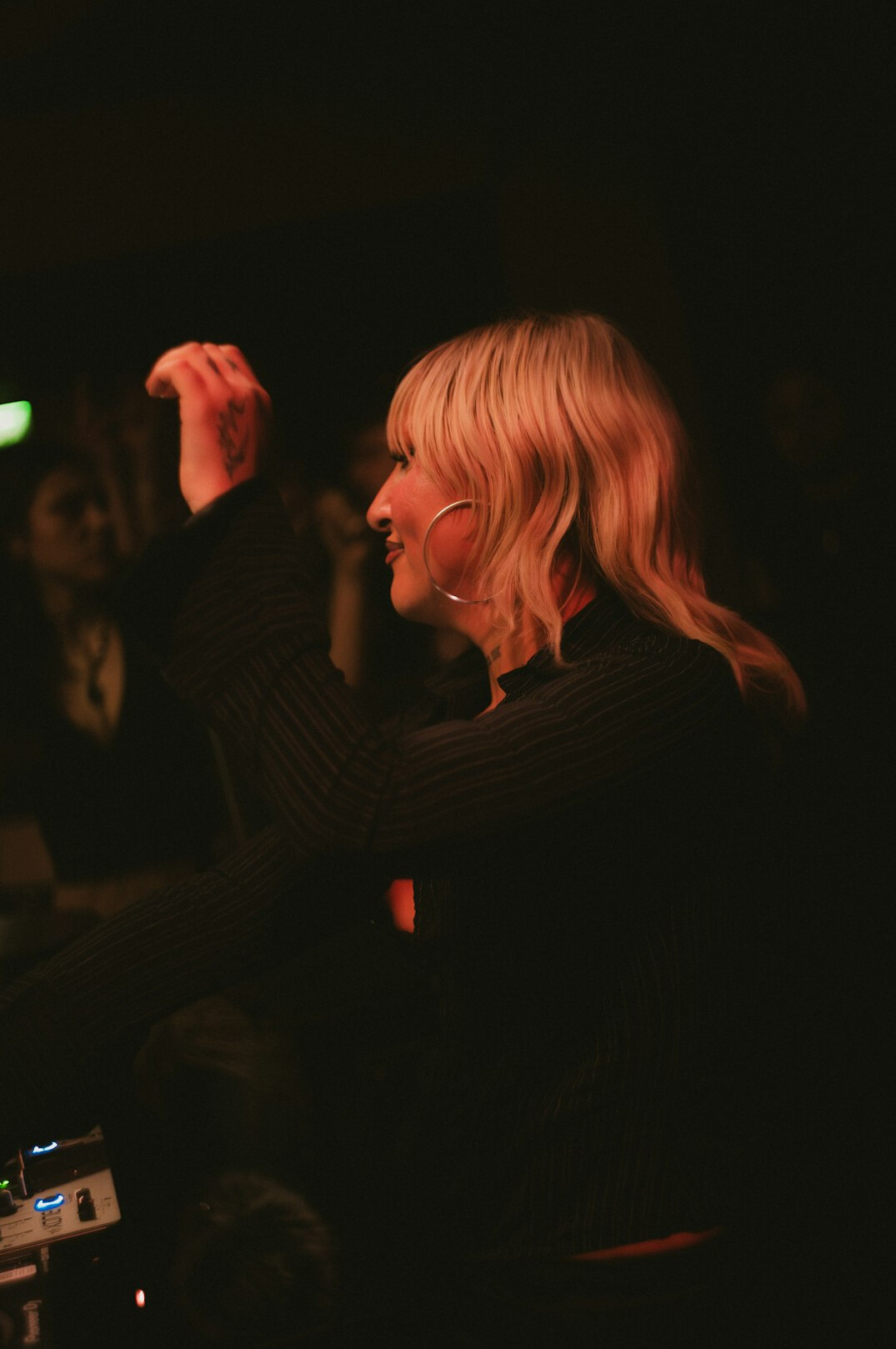 Portrait of a white British woman working as a live show producer